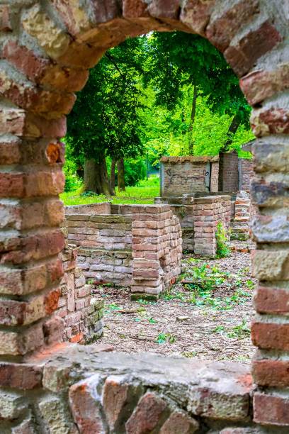 istock Old abandoned vintage rough stone castle wall ruins 690057438