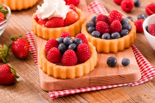 istock Tartlets with forest fruits. 690060304