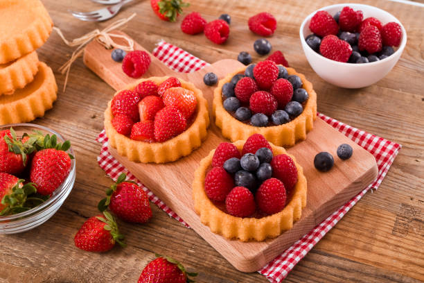 istock Tartlets with forest fruits. 690061156