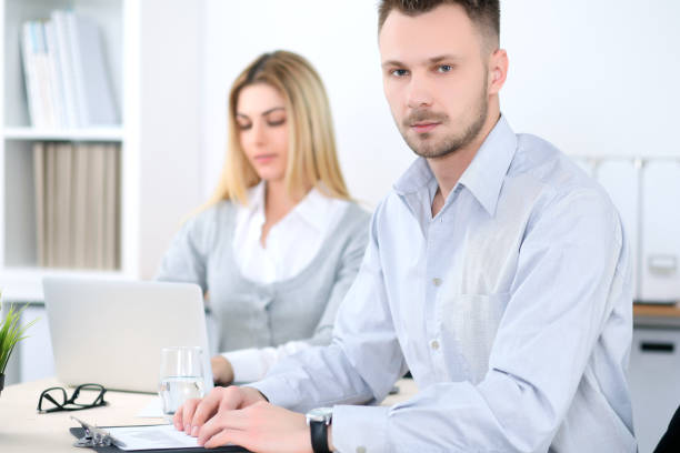 istock Two successful business partners working at meeting in office 690063884