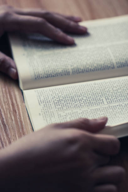 istock Woman reading the bible 690063950