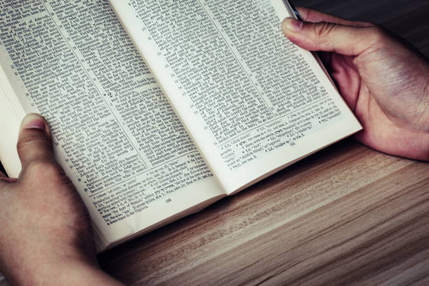 istock Woman reading the bible 690063970