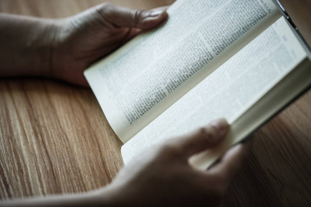 istock Woman reading the bible 690063976