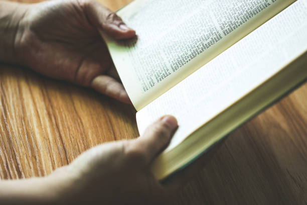 istock Woman reading the bible 690064004