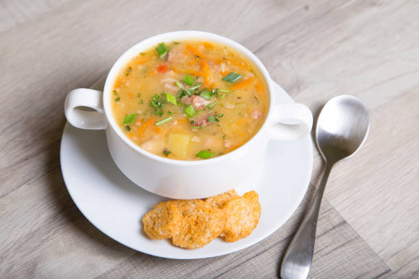 istock Pea soup with meat, smoked sausage and crackers 690065370