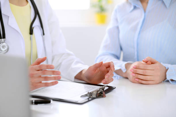 istock Doctor and patient are discussing something, just hands at the table 690071854