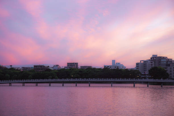 Dramatically beautiful sunset in pink gradation over lake. Fukuoka city, Japan.