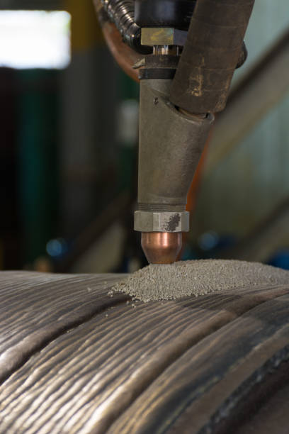 istock Overlay welding hard surfacing of steel roll by submerge arc welding process 690072972
