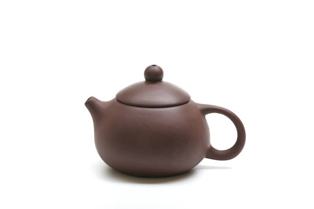 istock purple clay teapot isolated on white background 690073094