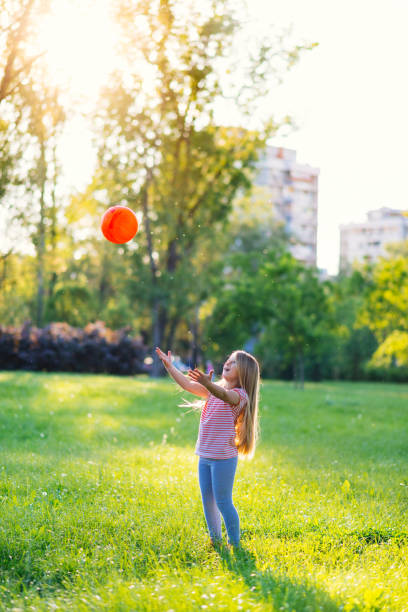 istock Cute young girl playing on her own 690073888