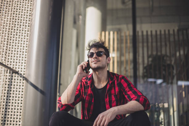 istock Hipster man on the phone 690080400