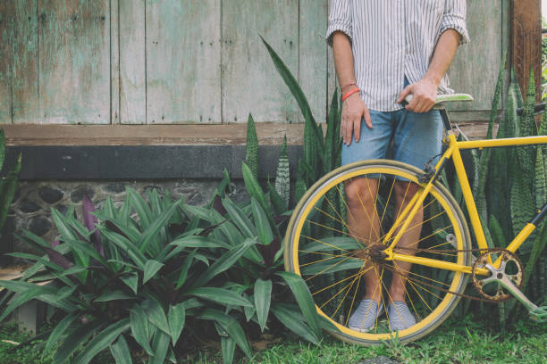 istock Young attractive man enjoying outdoors with old bicycle. 690083506