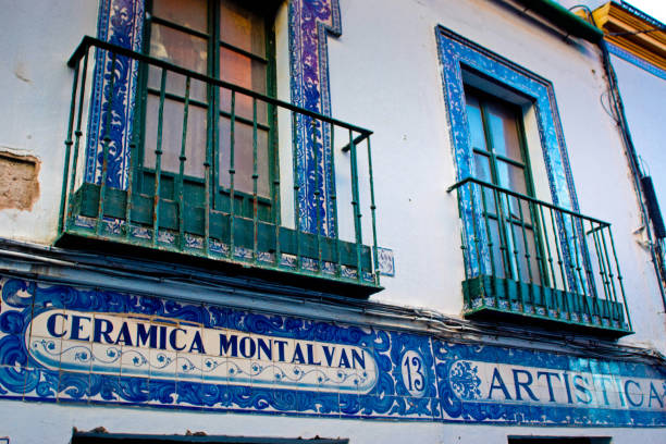 A small pottery store in Sevilla, Spain. The external sign is all in blue and white pottery tiles for the Ceramica Montalvan store.