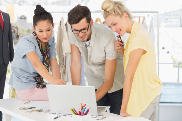 istock Fashion designers using laptop 690087688