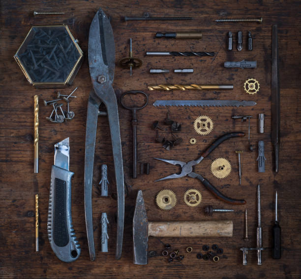 istock Collection of vintage tools displayed on a wood background. 690087790