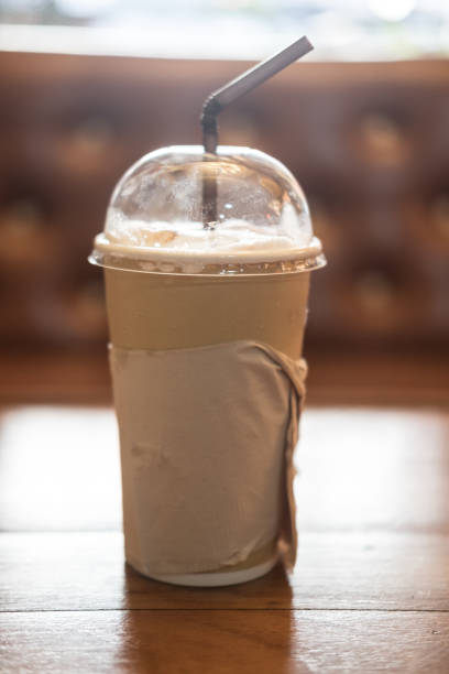istock Iced coffee in paper cup in coffee shop 690088954