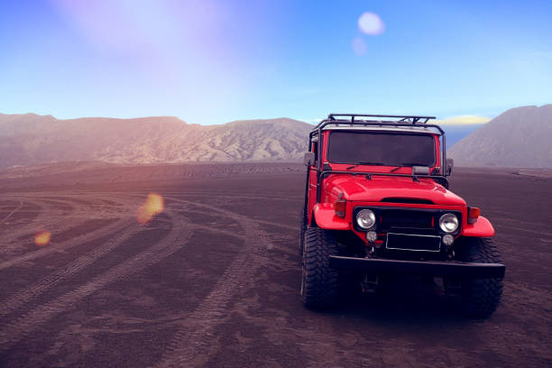 Off road car A red off-road vehicle in open space. 4x4 photos stock pictures, royalty-free photos & images