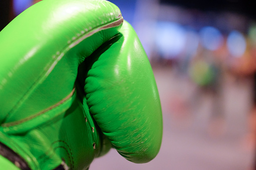 Close up of boxing glove with blurred background