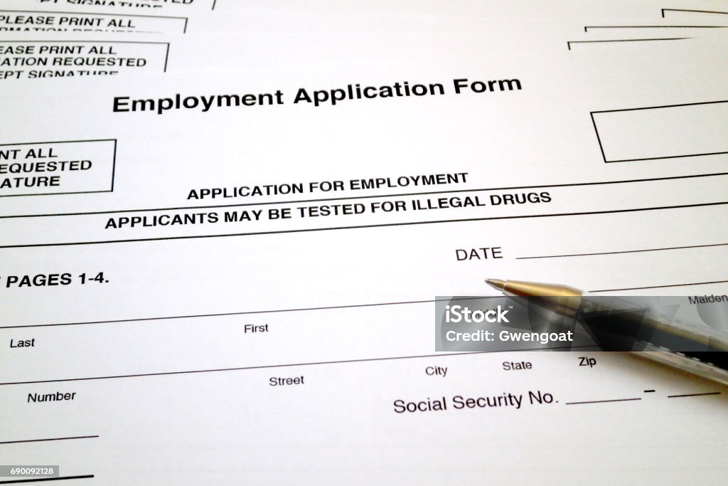 Apply for a job A ballpoint pen on the top of an Employment Application Form specifying that applicants may be tested for illegal drugs. Drug Test Stock Photo