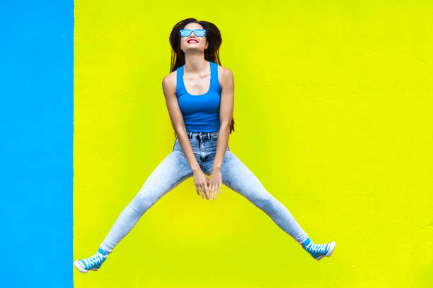istock Jumping young woman 690092266
