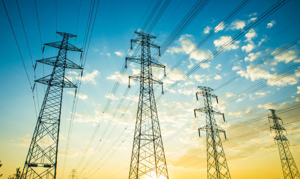 istock Electricity pylon at sunrise 690115422