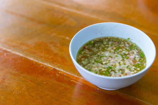 istock Thai style chilli spicy sauce dipping on wood table, seafood hot dip. 690122892