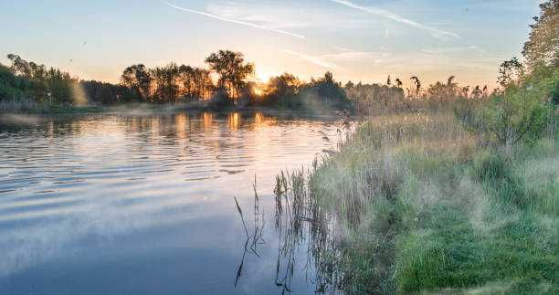istock Dawn over the river in silent summer day. 690126644