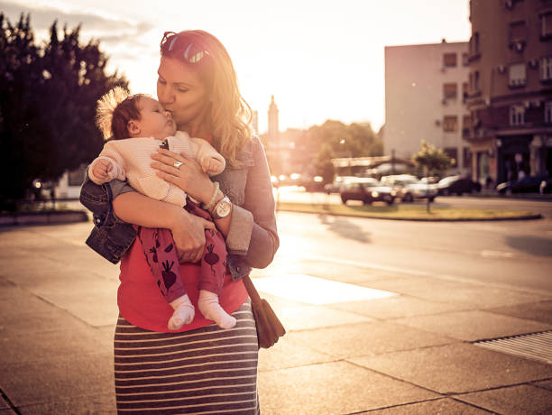 istock Young mom and newborn baby in downtown 690131268