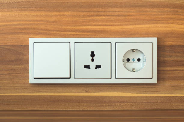 istock European switch and Sockets for plugging on wooden wall 690133916
