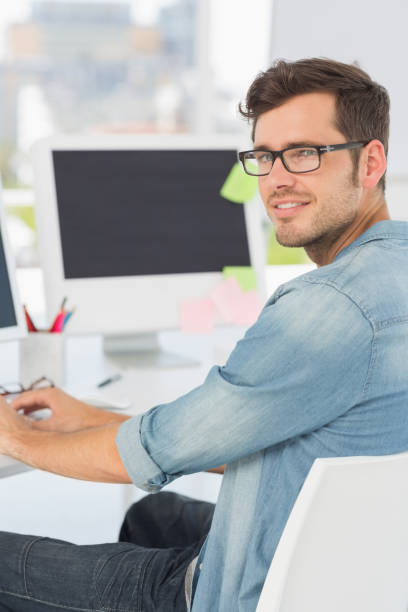 istock Side view portrait of a male artist using computer 690134194