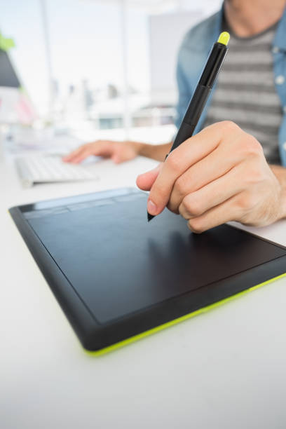 istock Casual male photo editor using graphics tablet 690134932