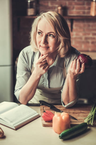istock Mature woman in kitchen 690135490