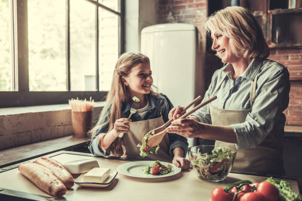 istock Grandma and granddaughter in kitchen 690138102