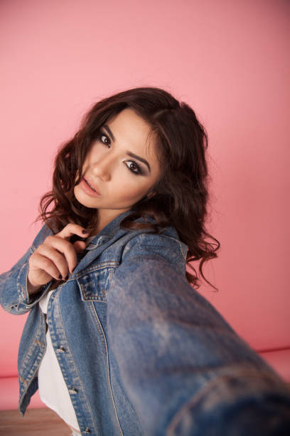 istock beautiful girl posing and photographing himself 690141002