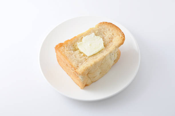 istock bread with butter french toast on a plate on white background 690145346