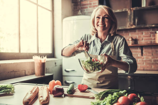 istock Mature woman in kitchen 690146508