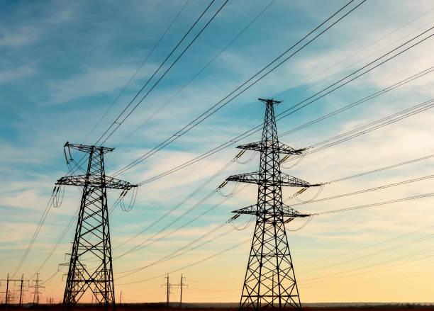 istock high-voltage power lines at sunset. electricity distribution station. high voltage electric transmission tower 690153120