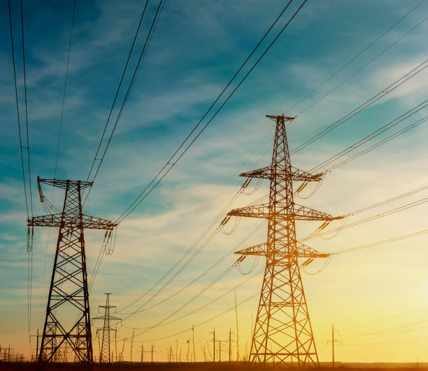 istock High-voltage power transmission towers in sky background. 690153132