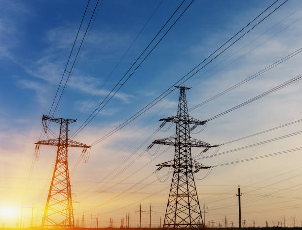 istock Silhouette of high voltage electrical pole. Sunset sky background. 690153156