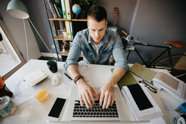 istock Man in the office typing on the laptop 690153516