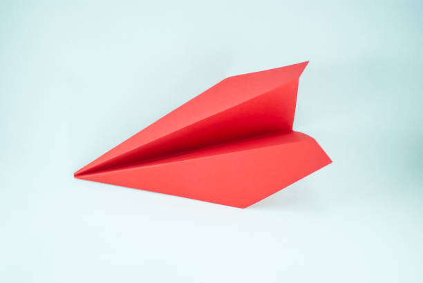 istock Red paper plane on a white background, isolated. 690164900
