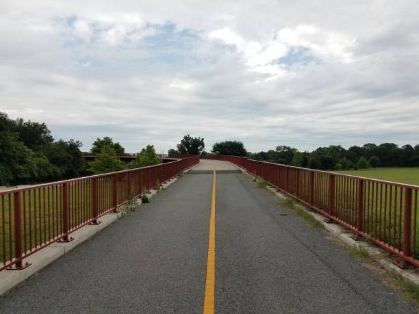 istock bike path and red metal railing 690166292
