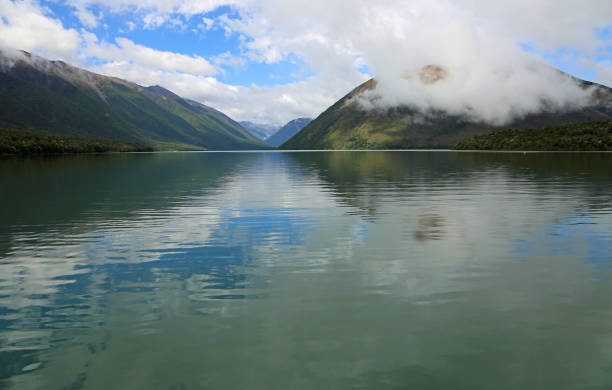 istock Blue sky and clouds over Rotoiti 690169432