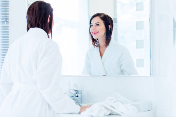 istock young woman in bathroom 690169874