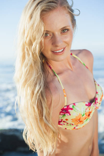 istock Gorgeous blonde in floral bikini posing at the beach 690183070