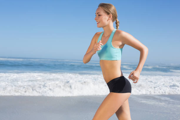 istock Fit woman jogging on the beach 690183730