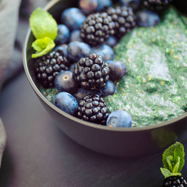 Healthy organic spirulina porridge topped with berries