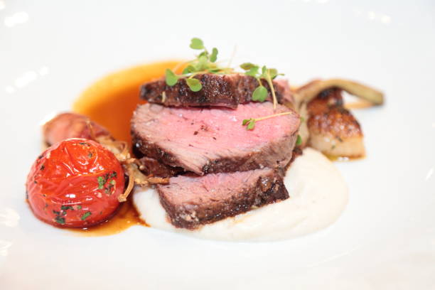 istock Roasted beef, parsnip puree, blistered tomato, mushrooms. 690187114