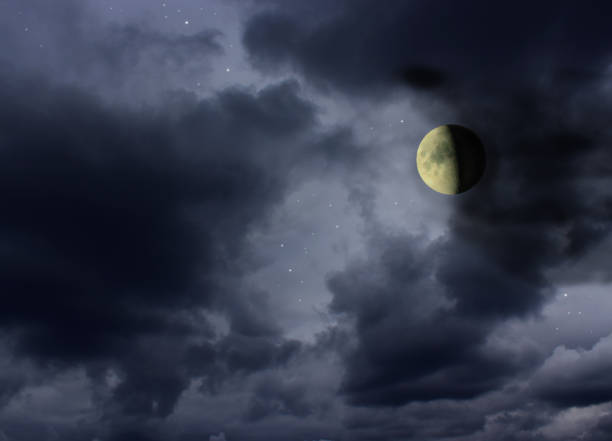 Moon in the night cloudy sky