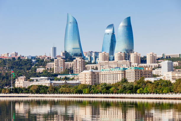 Flame Towers in Baku Baku Flame Towers is the tallest skyscraper in Baku, Azerbaijan with a height of 190 m. The buildings consist of apartments, a hotel and office blocks. caucasus photos stock pictures, royalty-free photos & images